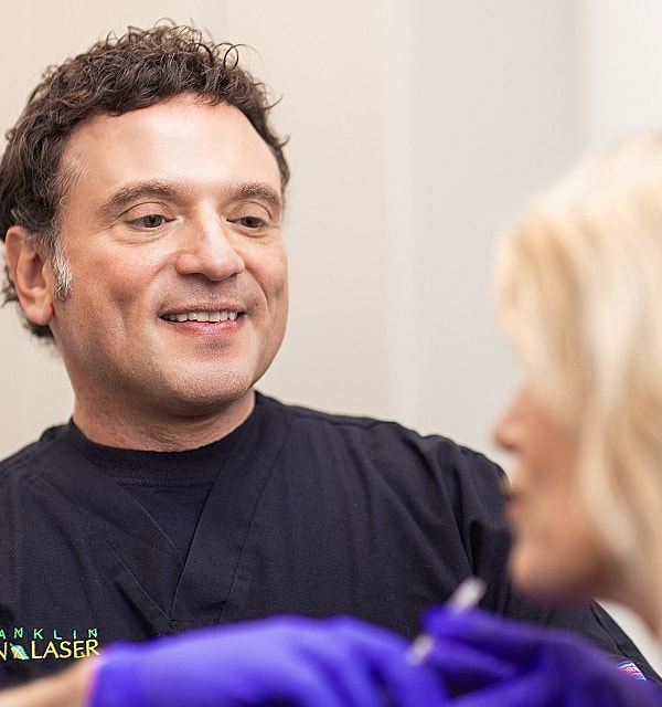 Patient consultation at a medical aesthetic practice.